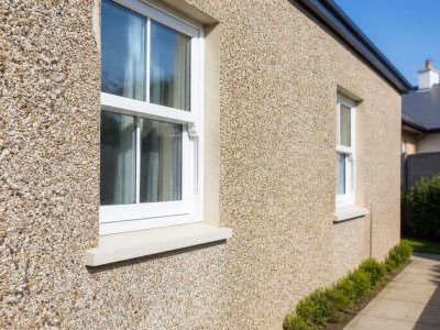 Home exterior showing pebble dash wall on a sunny